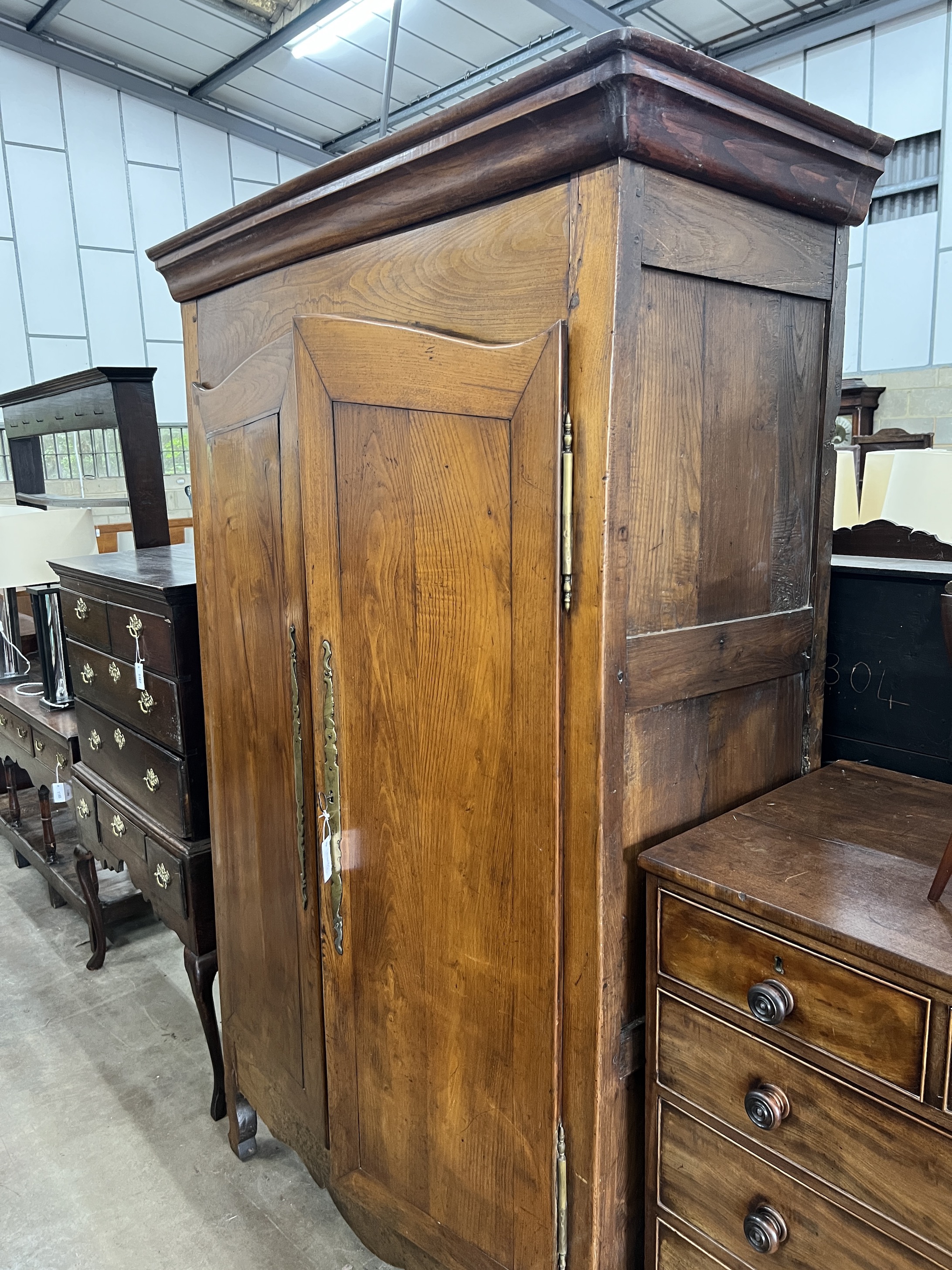 A 19th century French Provincial elm armoire, width 138cm, depth 60cm, height 226cm